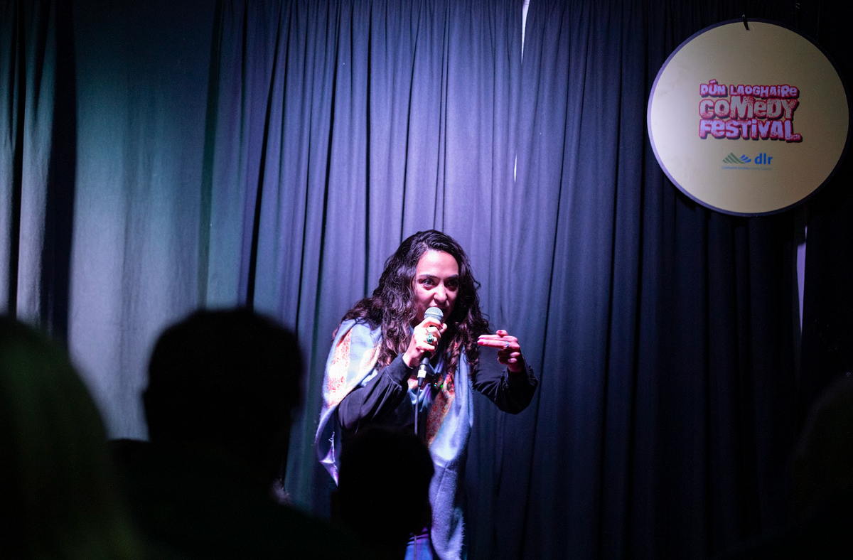 Crowd laughing during a festival show